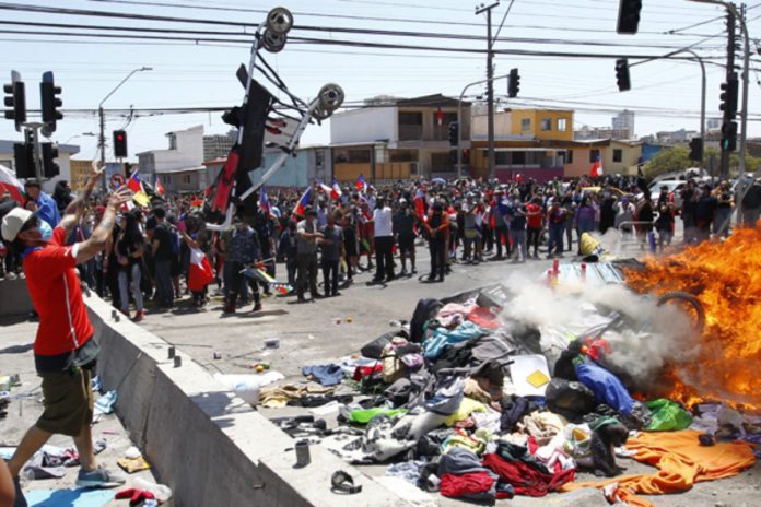 Marcha en Chile, pertenencias venezolanos desalojados