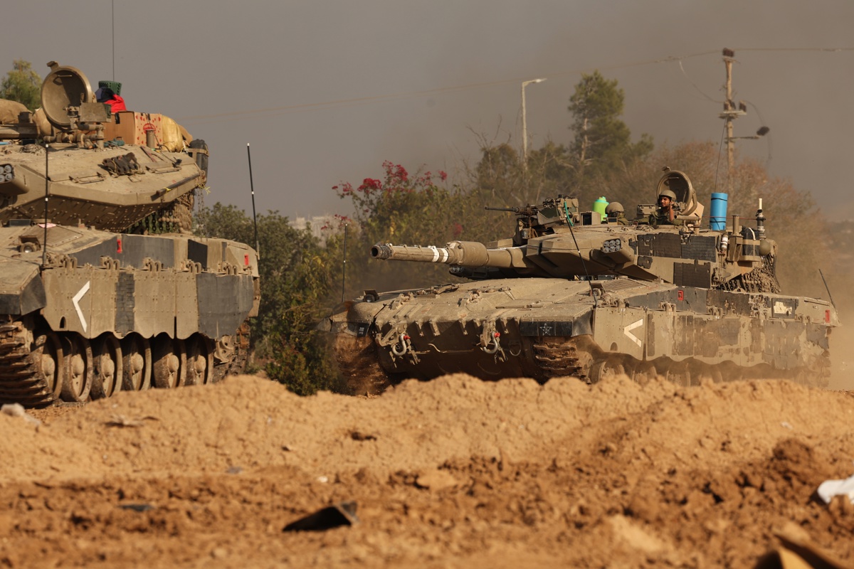 Israeli soldiers maneuver along Gaza border