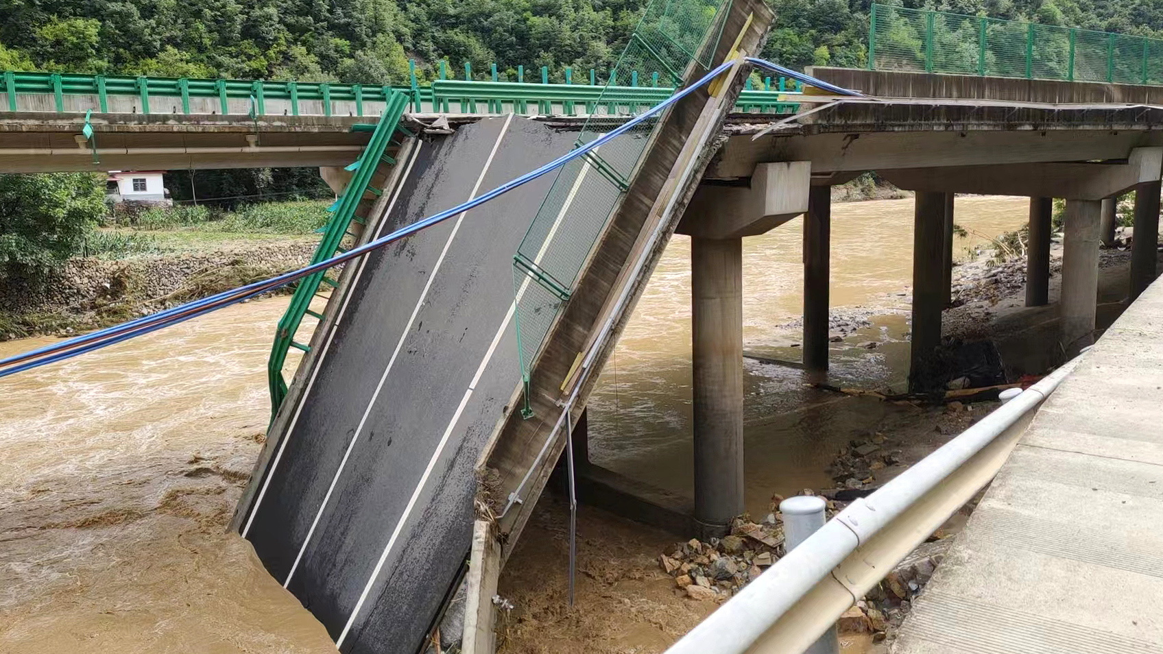 At least 11 dead in bridge collapse after flash floods in China’s Shaanxi